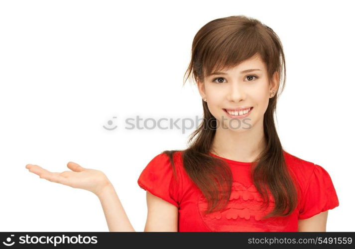 teenage girl showing something on the palm of her hand