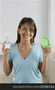 Teenage girl showing teeth whitening solution