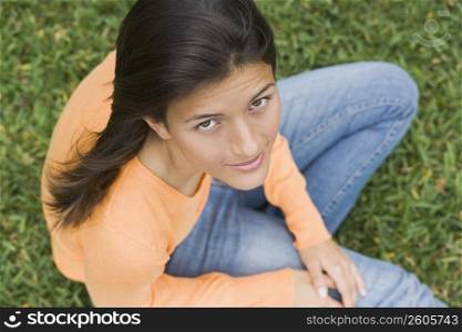 Teenage girl sitting in a park