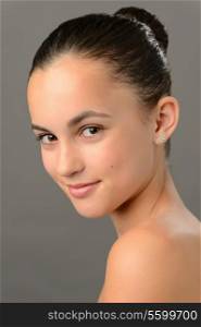 Teenage girl skin beauty romantic purity ballet face portrait on gray