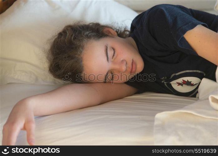 Teenage girl sleeping on the bed, Utila, Bay Islands, Honduras