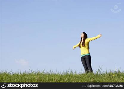 Teenage Girl Standing In Summer Meadow