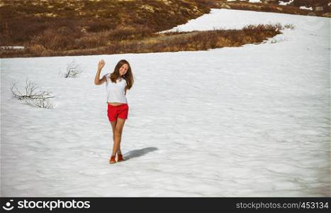 Teenage girl standing in the snow, Norway