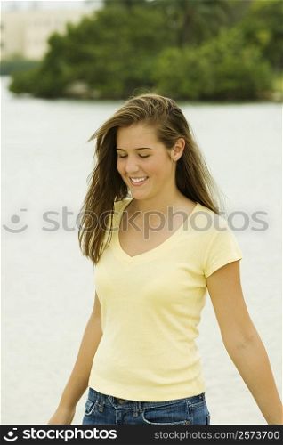 Teenage girl standing on the beach