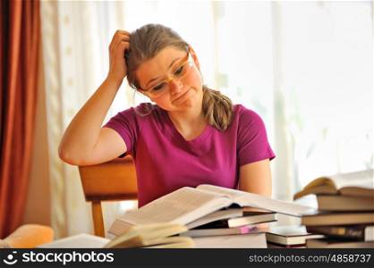 Teenage girl studying at home