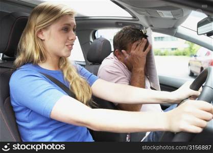Teenage Girl Taking A Driving Lesson