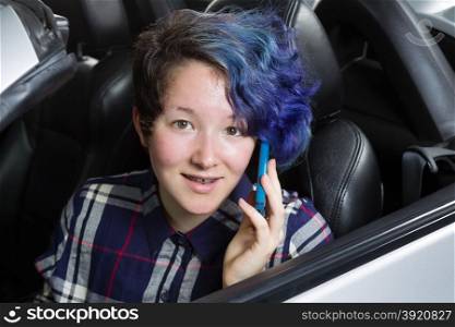 Teenage girl talking on cell phone while looking forward. Mixed Asian and Caucasian girl.