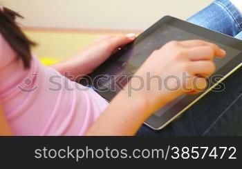 Teenage Girl Using Digital Tablet close up. Login personal account.