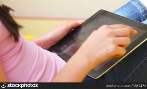 Teenage Girl Using Digital Tablet close up. Login personal account.