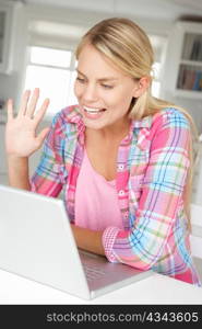 Teenage girl using laptop