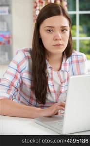Teenage Girl Victim Of Online Bullying With Laptop