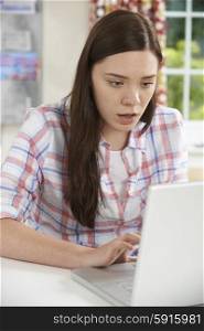 Teenage Girl Victim Of Online Bullying With Laptop