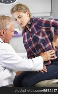 Teenage Girl Visits Doctor&#39;s Office With Back Pain