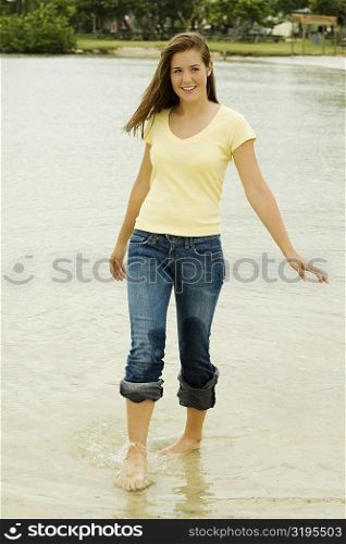Teenage girl walking on the beach