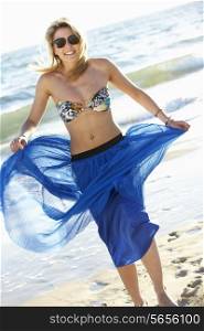 Teenage Girl Wearing Sarong On Beach Holiday
