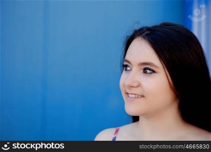 Teenage girl with a blue background on the outside