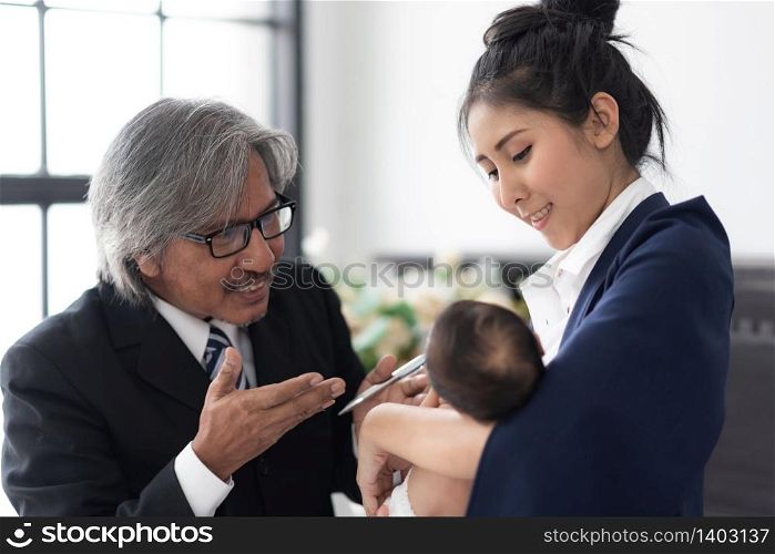 Teenage girl with baby in her arms