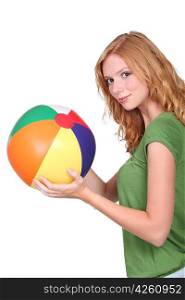 Teenage girl with beach ball