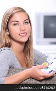 Teenage girl with games controller