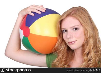 teenage girl with inflatable beach ball