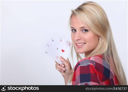 Teenage girl with playing cards