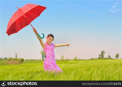 teenage girl with red umbrella in wheat field