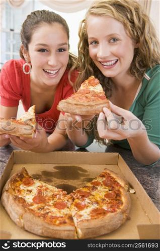 Teenage Girls Eating Pizza