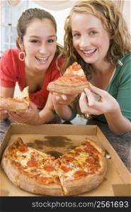 Teenage Girls Eating Pizza