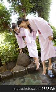 Teenage girls in Japanese garden