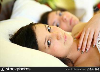 Teenage Girls Lying On the Bed together