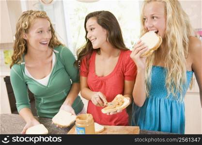 Teenage Girls Making Sandwiches