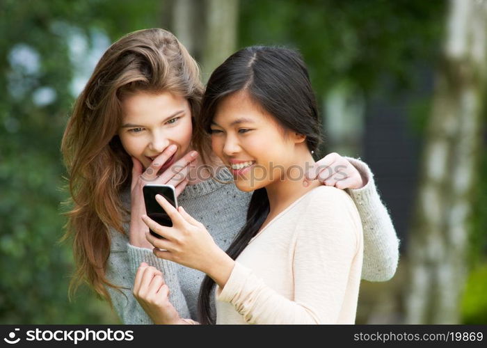 Teenage Girls Reading Text Message Together