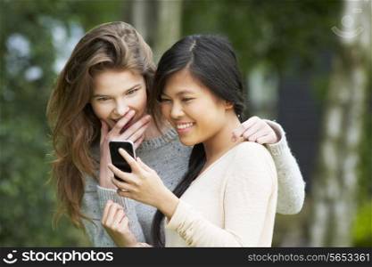 Teenage Girls Reading Text Message Together
