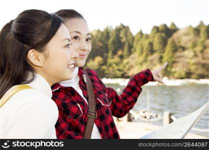 Teenage girls smiling and pointing