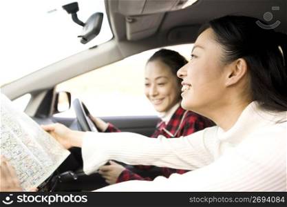 Teenage girls smiling in a car