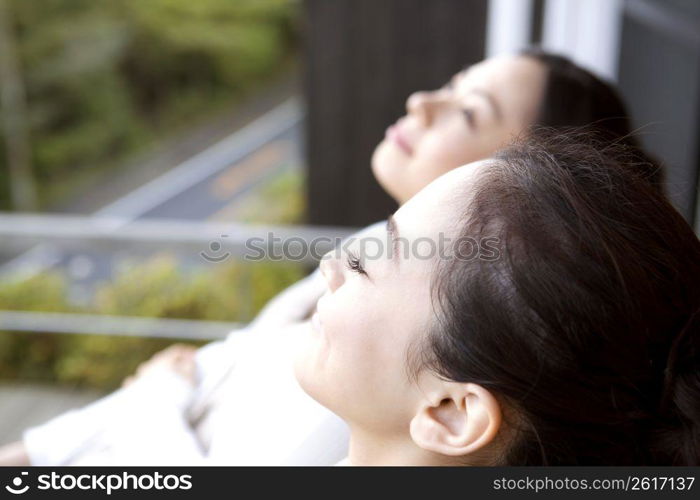 Teenage girls sunbathing