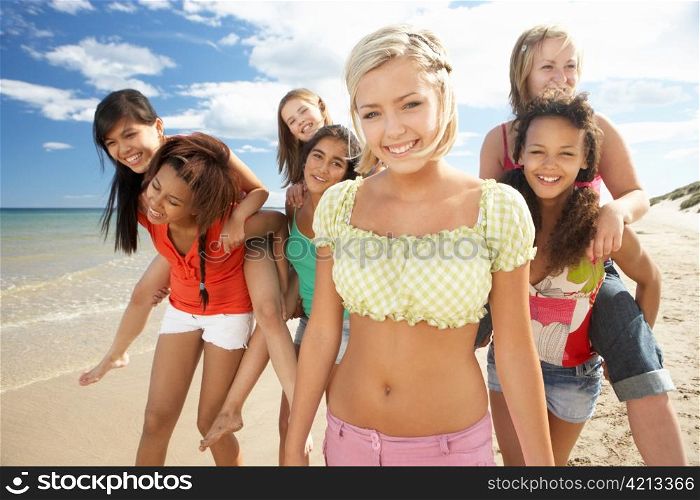 Teenage girls walking on beach