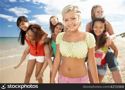 Teenage girls walking on beach