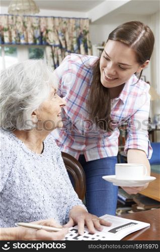Teenage Grandmother Bringing Grandmother Hot Drink