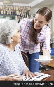 Teenage Grandmother Bringing Grandmother Hot Drink