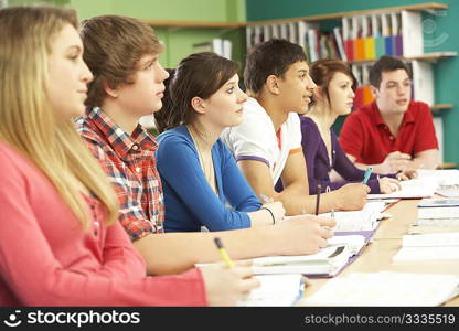 Teenage Students Studying In Classroom