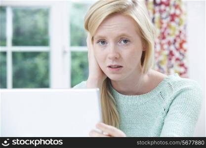 Teenage Victim Of Online Bullying With Laptop