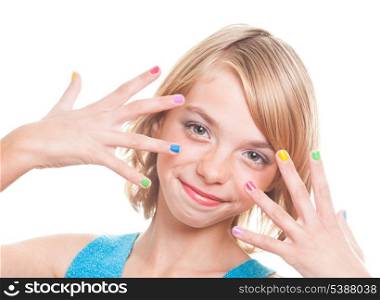 Teenager blonde girl&#39;s face with multicoloured nails close up