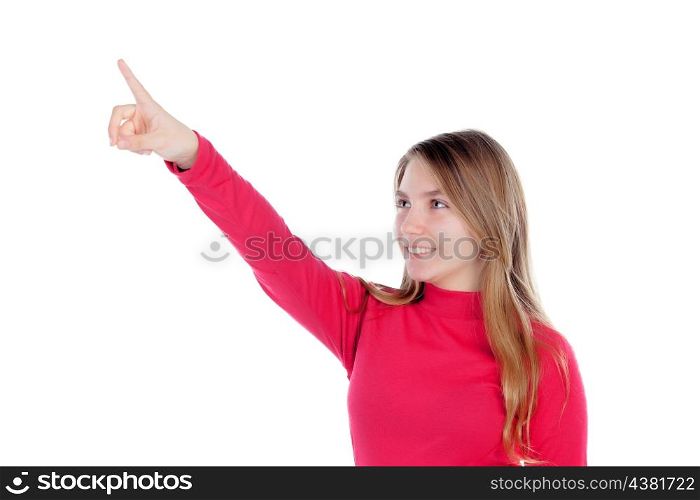 Teenager blonde girl in red indicating something with her finger isolated on a white background