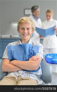 Teenager boy dental checkup dentist assistant standing at stomatology clinic