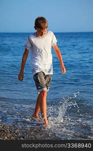 teenager boy going on seacoast