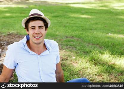 Teenager boy in the park. Teenager boy in the park sitting on grass