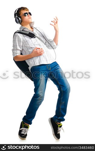 teenager boy is listening for music on white background