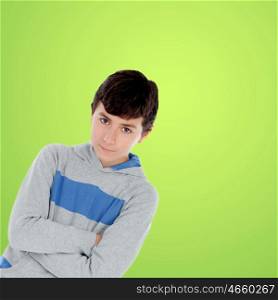 Teenager boy looking at camera with green background