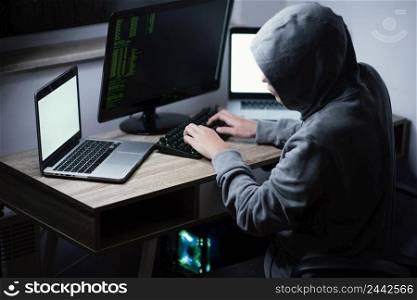 teenager boy playing computer laptop